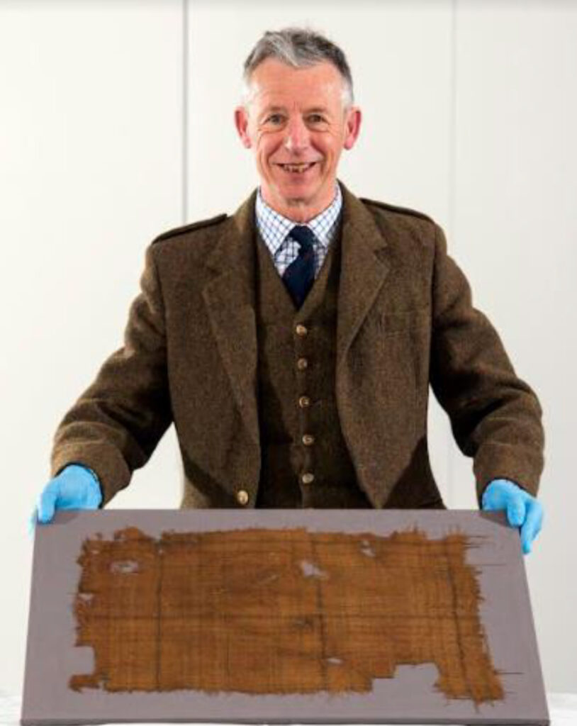 Peter MacDonald with the 16th-century Glen Affric tartan, Scotland's oldest tartan