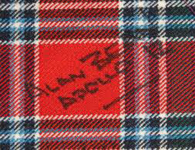 Piece of the MacBean Moon Tartan signed by Alan Bean